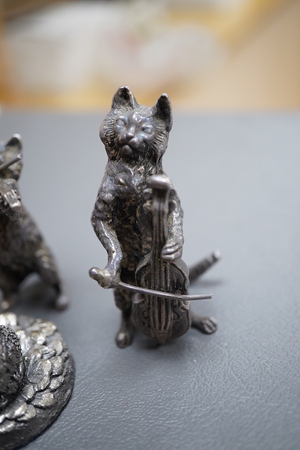 An Elizabeth II silver four piece miniature cat band by S.J. Rose & Son, Birmingham, 1976, tallest 58mm, together with a modern 925 miniature model of a standing grizzly bear and a modern silver model of a kitten(filled)